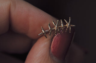 Grimpeur d'oreille de suture