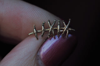 Grimpeur d'oreille de suture