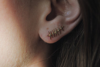 Grimpeur d'oreille de suture