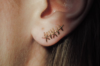 Grimpeur d'oreille de suture